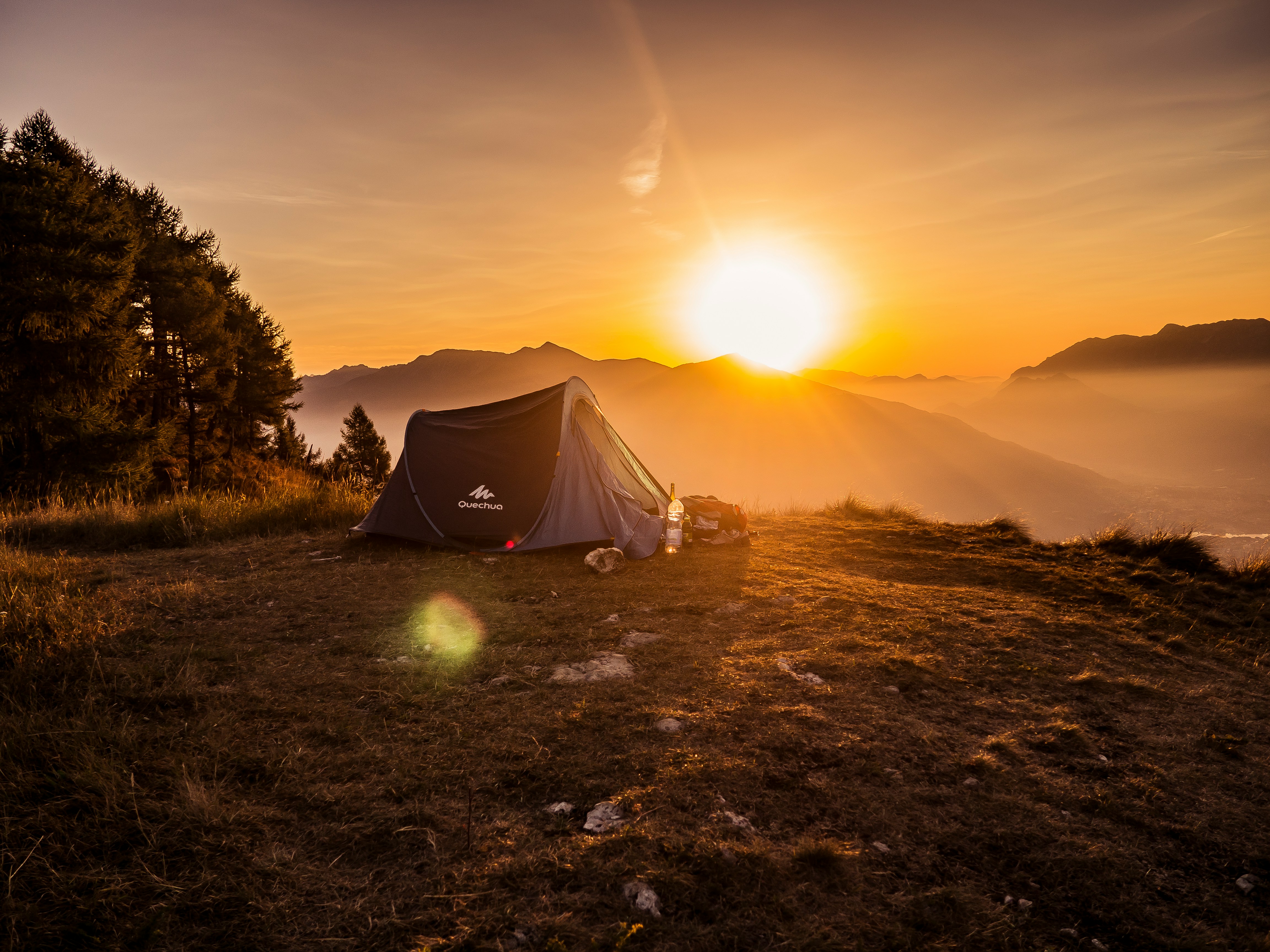 Backpacking tent and gear at a campsite