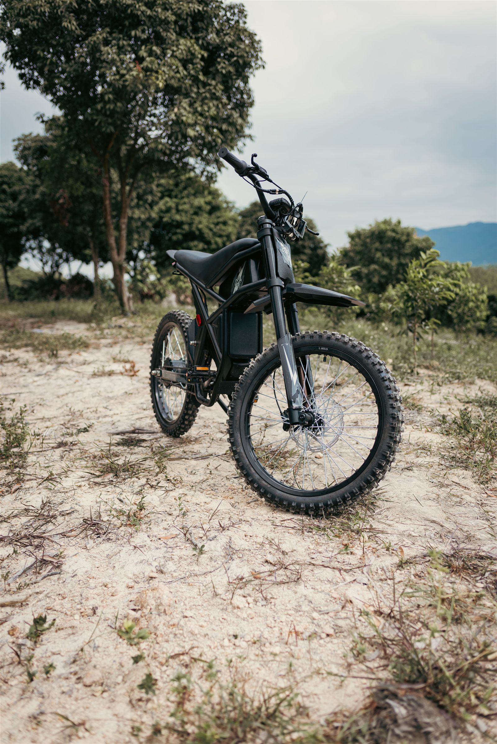 Off-road style electric bike parked outdoors, similar to CEMOTO's dirt bike lineup
