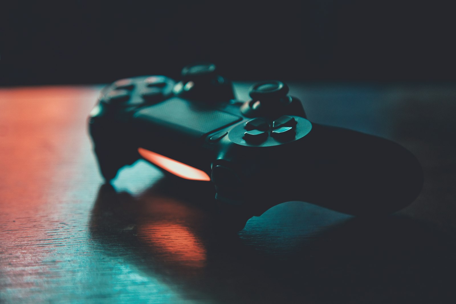 Wireless gaming controller on a wooden surface