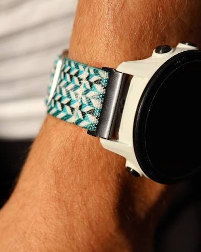 Fitness tracker worn on a tattooed wrist